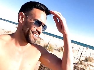 Sporty Youthfull Man Strips Naked On A Public Beach In Barcelona After A Gym Workout
